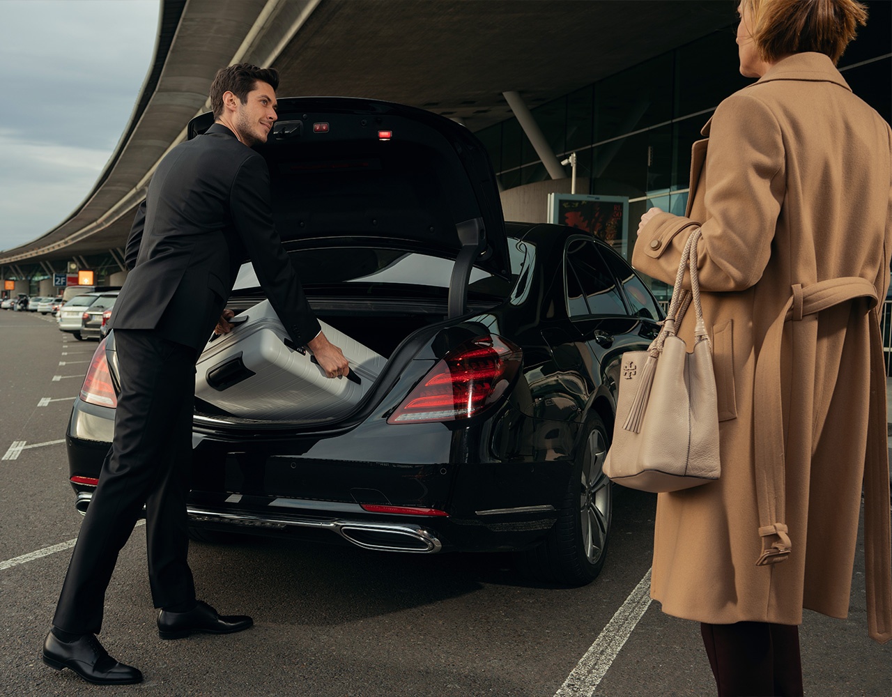 EGT chauffeur loading luggage at airport
