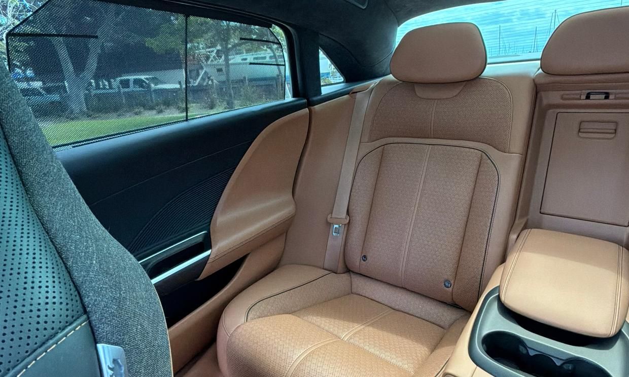 Lucid Air Grand Touring rear seats in tan leather with fold-down armrest