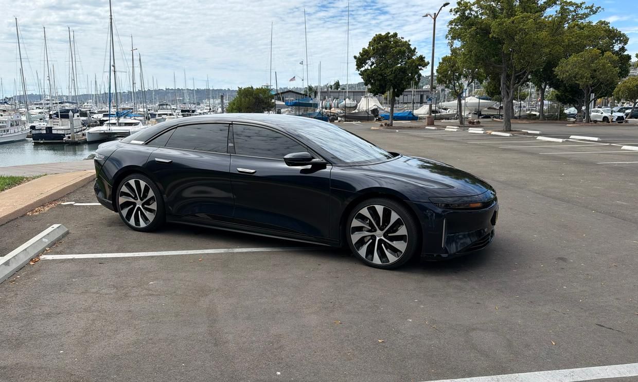 Lucid Air Grand Touring, front three-quarter view, parked by the Point Loma marinas in San Diego